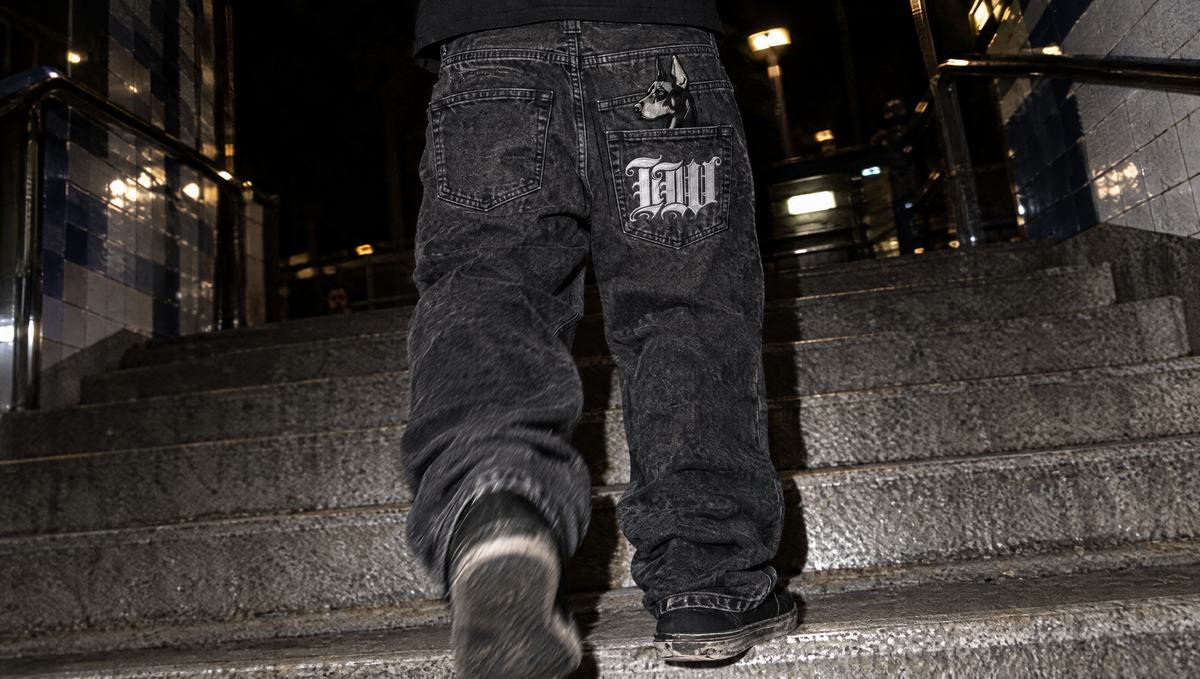 Dawg Jeans back pocket with Doberman and IW embroidery on metro stairs