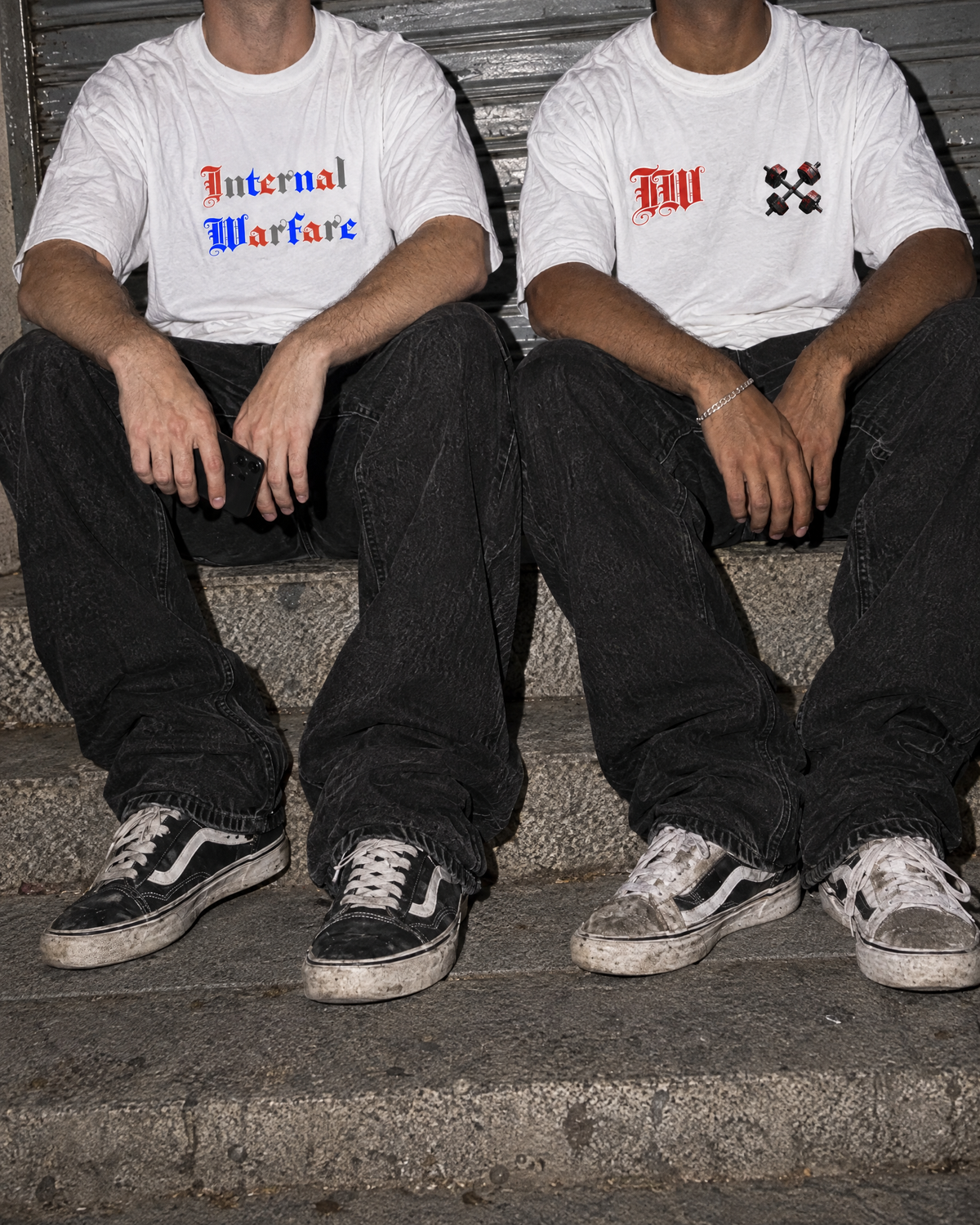 Blood Sweat & Tears Tee and Dumbbell Tee worn on street steps at night